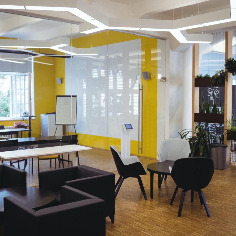 View of empty modern office with sofa, table, chair